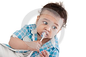 Indian baby brushing teeth