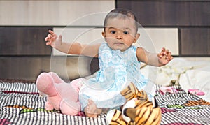 Indian baby girl playing with toys