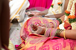 Indian Bangles and henna in the hands of bride