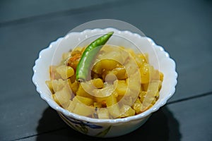 Indian Bengali Food Puri or Luchi with Aloo Sabji . Indian Poori is a bread deep fried in refined oil.