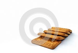 Indian biscuits stacked over white background