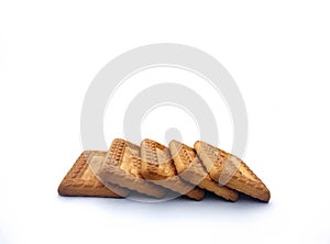 Indian biscuits stacked over white background