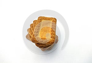 Indian biscuits stacked over white background