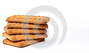 Indian biscuits stacked over white background
