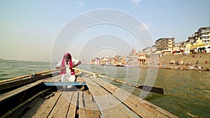 indian boatman at varanasi ganga river