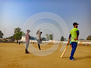 an indian boy holded cricket bat during match at playground in India January 2020