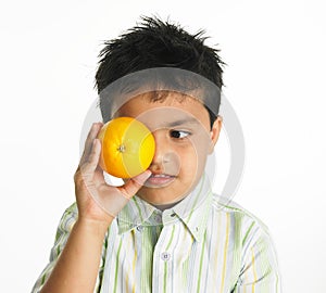 Indian boy with orange