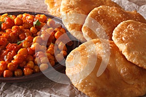 Indian bread puri and chana masala macro. Horizontal