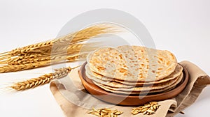 Indian Bread Roti or Chapati with Wheat Ears on Tabletop Background