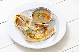 Indian bread or Roti telur with curry sauce