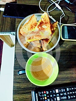 Indian breakfast potato toast and a cup of tea