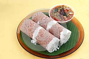 Indian breakfast Puttu and green peas curry.