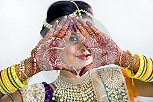 Indian Bride with Mehendi hands or Henna