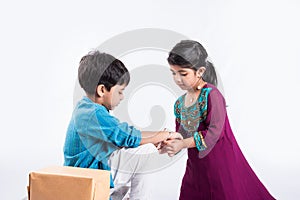 Indian brother and sister celebrating rakshabandhan or rakhi festival