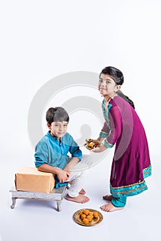 Indian brother and sister celebrating rakshabandhan or rakhi festival