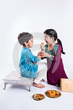 Indian brother and sister celebrating rakshabandhan or rakhi festival