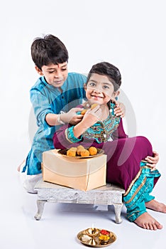 Indian brother and sister celebrating rakshabandhan or rakhi festival