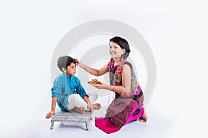 Indian brother and sister celebrating rakshabandhan or rakhi festival