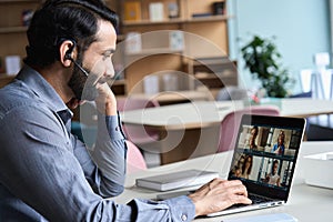 Indian business man having virtual team meeting on video conference call.