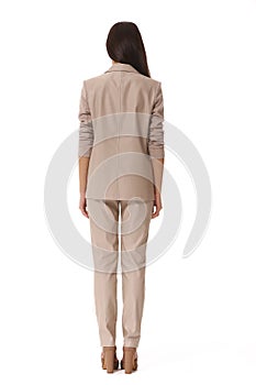 Indian business woman in beige pant suit full body protrait in high heels