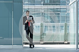 Indian businessman using a tablet PC indoors