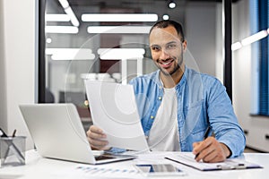 Indian businessman working from home in living room