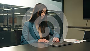 Indian businesswoman come in to office sit at desktop table workplace Arabian female manager business girl woman start