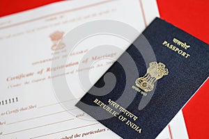 Indian Certificate of registration of marriage blank document and indian passport on table