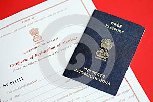 Indian Certificate of registration of marriage blank document and indian passport on table