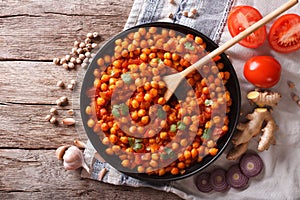 Indian Chana masala with ingredients. horizontal top view