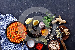 Indian chana masala on a plate with ingredients