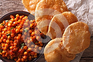 Indian Chana masala and puri bread close-up. Horizontal top view