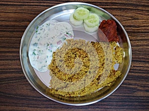 Indian chicken biriyani with Kaleb raita and cucumber slices