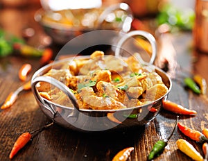 Indian chicken curry in balti dish photo