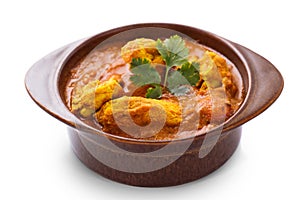 Indian chicken curry served in pottery