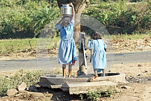 Indian children at the water pump