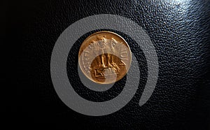 Indian coin close up view in leather black background