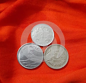 INDIAN COIN UPON A SAFRAN  HANDKERCHIEF