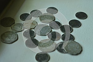 Indian coins spred on a canvas bord photo