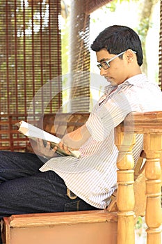 Indian College Student Reading Textbook