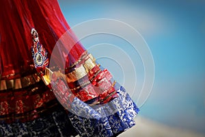 Indian colorful dress with beads and crystals at culture festival market