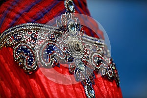 Indian colorful dress with beads and crystals at culture festival market