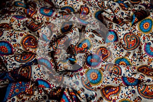 Indian colorful fabric with red, blue and green colors.