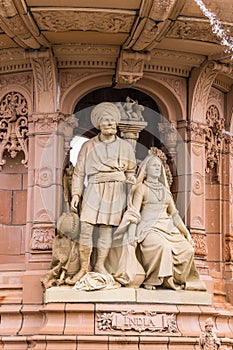 Indian couple at base of Doulton Fountain, Glasgow Scotland UK.