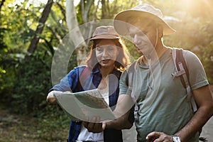 Indian Couple trekking together through forest