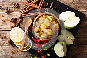 Indian cuisine: apple chutney with lemon and spices close-up on