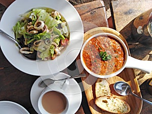 Indian cuisine calamari salad garlic bread with sausse. Goa, India