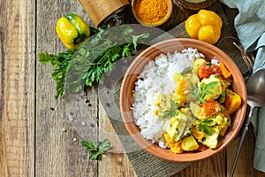 Indian cuisine dish sabji. Traditional Indian vegetable stew with soft cheese and turmeric on a wooden table.