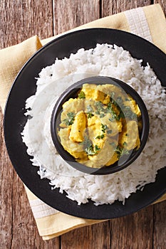 Indian Cuisine: Korma chicken in coconut sauce and basmati rice.