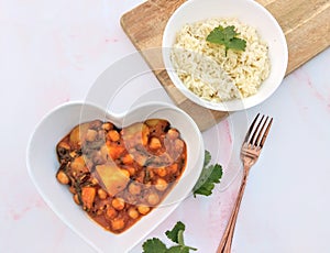 Indian cuisine with potatoe curry and rice